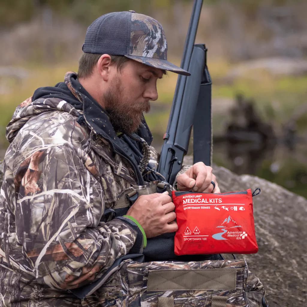 Adventure Medical Kits Sportsman Series Medical Kit - 100 [2-Stage Waterproofing, Trauma Supplies, Wilderness First Aid Manual]