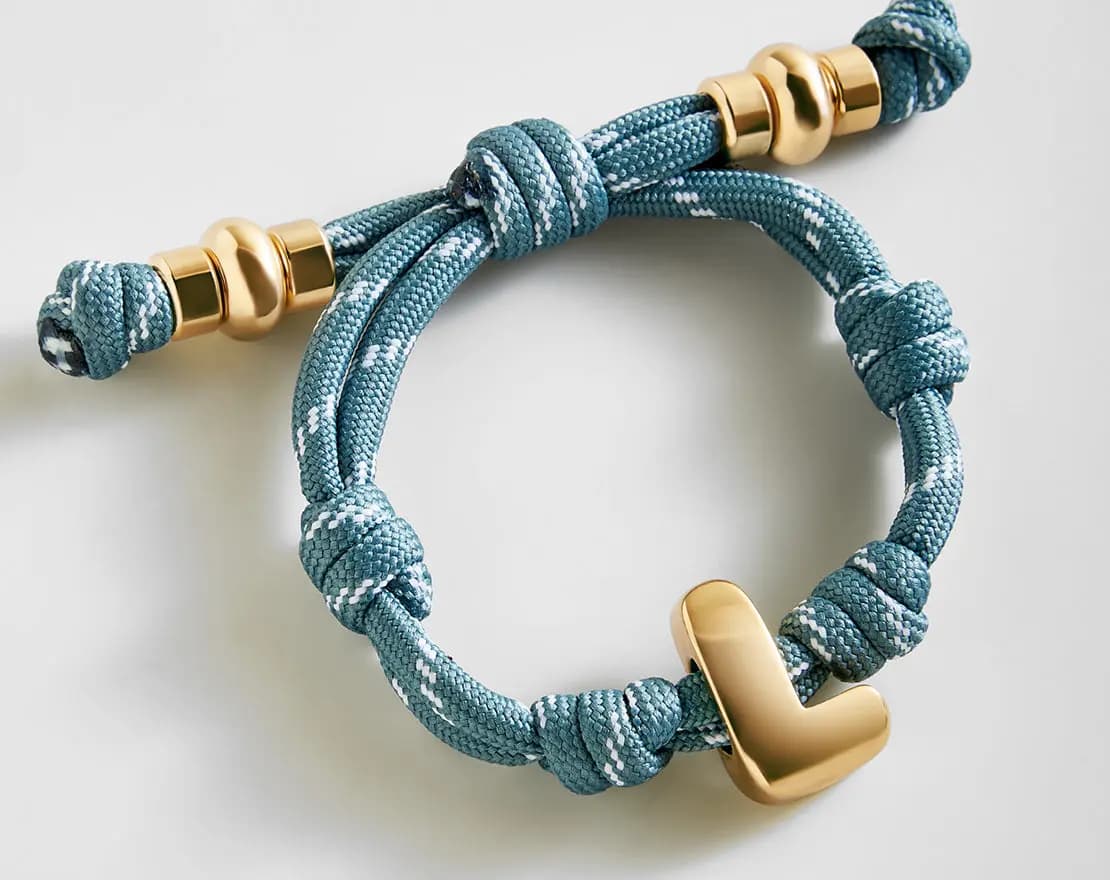 BaubleBar Knotty Initial Custom Bracelet - Dusty Blue Single Letter Gold [Adjustable pull-tie so you can get a perfect fit, Personalized with the capital letter of yo, Choose from 