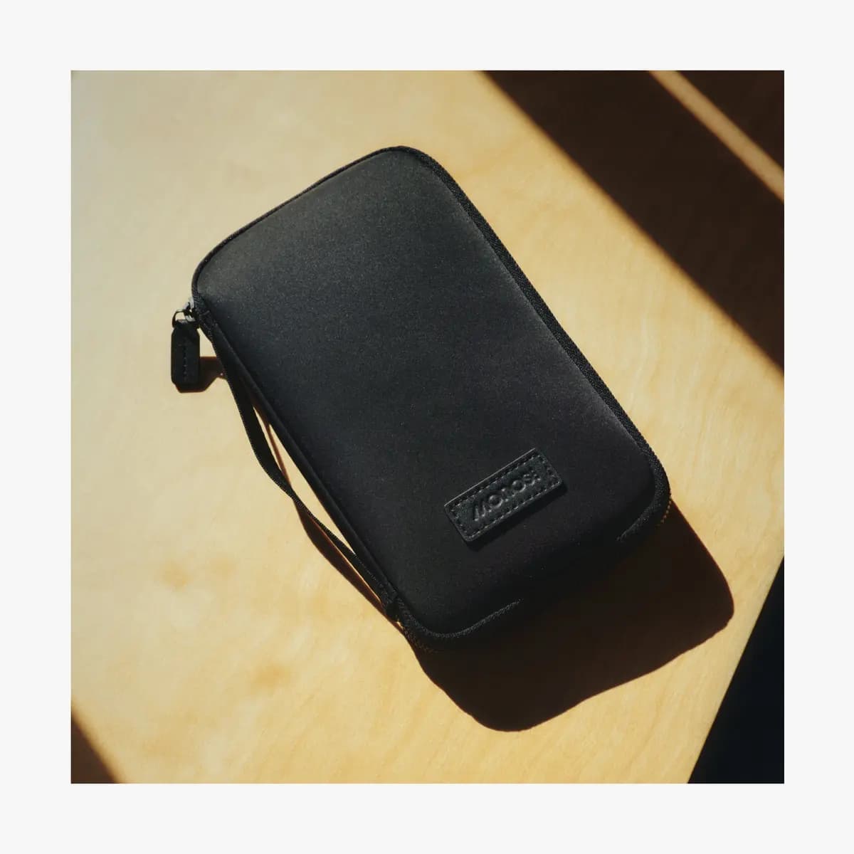 Monos Metro Travel Wallet Carbon Black [Water and scratch-resistant finish, Secured with a zippered main compartment, Lined with soft cotton twill throughout]