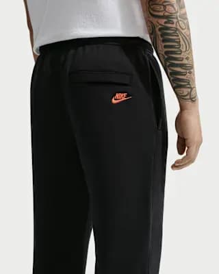 Nike Sportswear Club Men's Fleece Joggers Black/Black/Safety Orange [Body: 80% cotton/20% polyester. Side pocket knuckle side: 100% cotton, Machine wash, XS-4XL Tall]