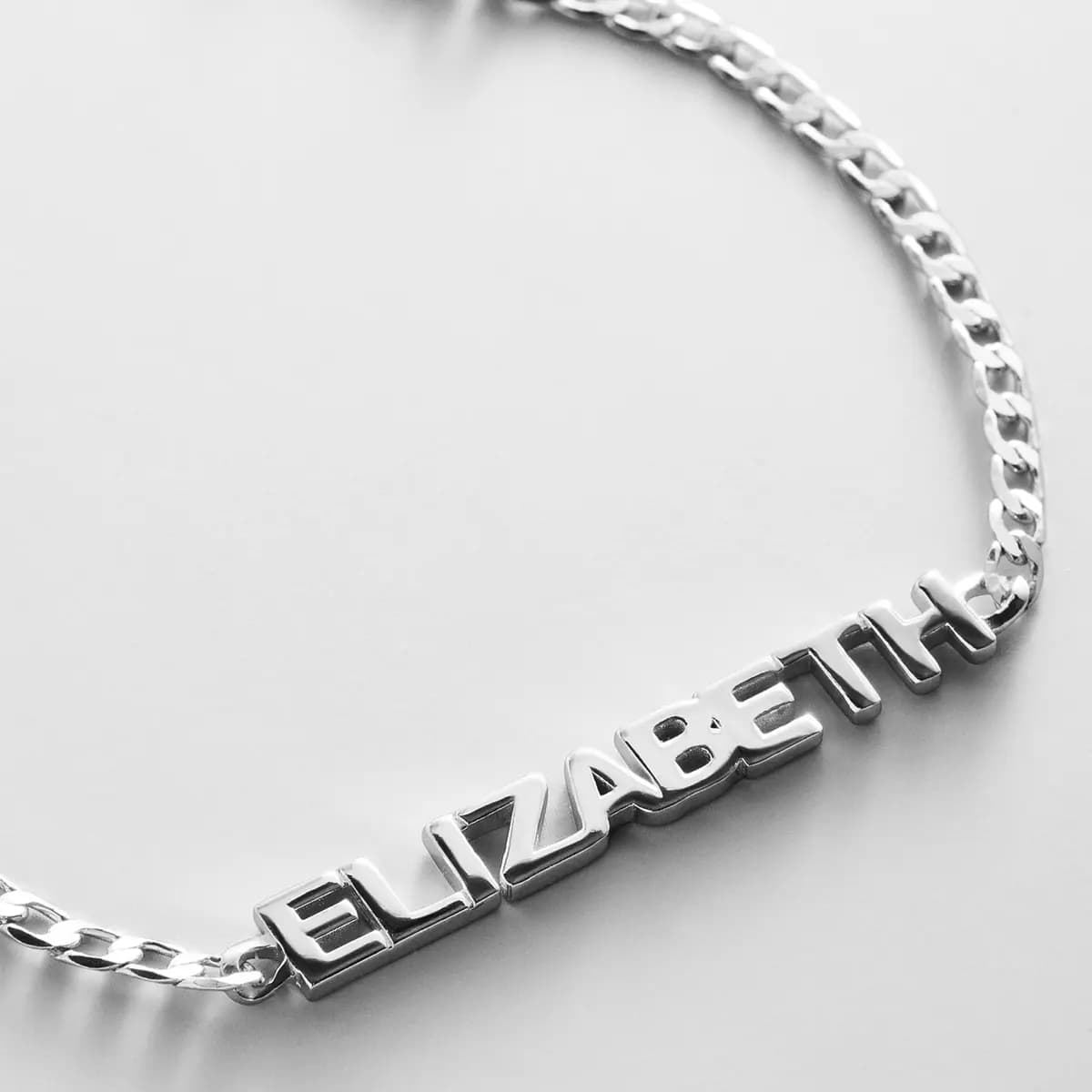 BaubleBar Curb Chain Custom Bracelet - Silver Script [Set on a smooth curb chain, Customize with up to 10 letters in the fon, Available in glossy gold or sleek silver,]