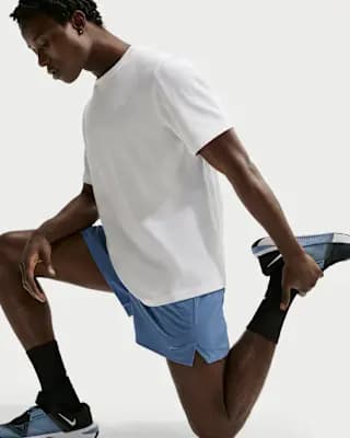 Nike Unlimited Men's Dri-FIT 5" Unlined Versatile Shorts Indigo Storm/Black/Indigo Storm [Body: 86% polyester/14% spandex. Mesh: 100% polyester., Machine wash, XS-4XL Tall]