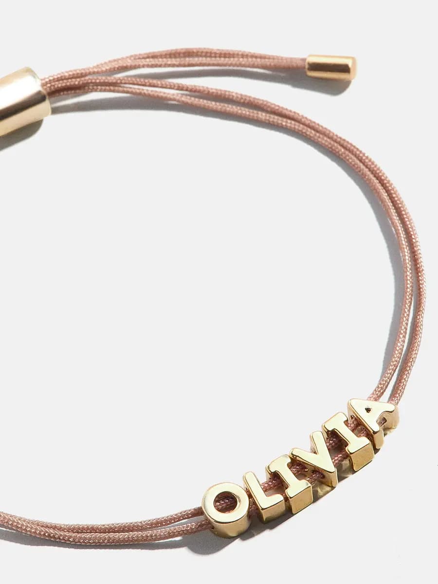 BaubleBar Custom Cord Bracelet - Taupe [Miniature gold letters are water resistant, Choose from 18 cord colors]