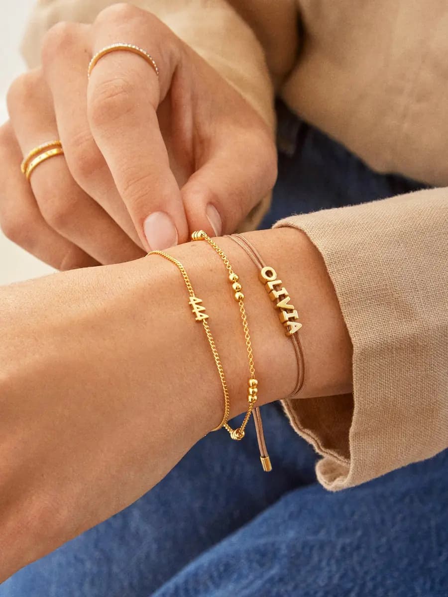 BaubleBar Custom Cord Bracelet - Taupe [Miniature gold letters are water resistant, Choose from 18 cord colors]