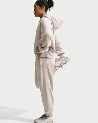 Nike One Women's Therma-FIT Mid-Rise Fleece Joggers Cream II/White [Body: 100% polyester. Pockets: 75% polyester/13% cotton/12% rayon., Machine wash, XXS (00)-XXL (20–22)]