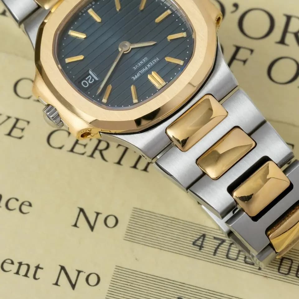 Patek Philippe Nautilus ref. 4700 steel & gold box papers and invoice