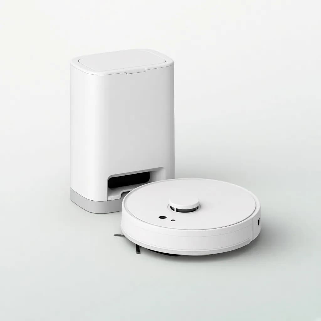 Round white robot vacuum sitting in front of its tall self-emptying dock