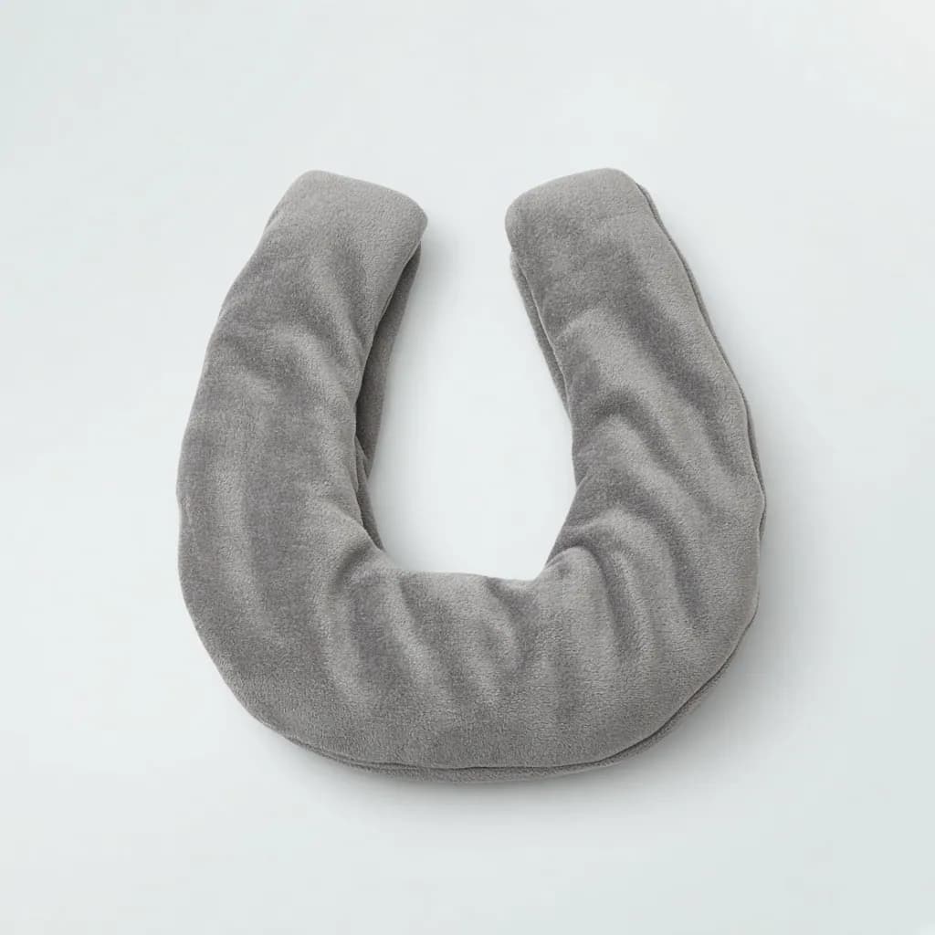 Plush heated neck and shoulder wrap in soft grey draped in a u shape